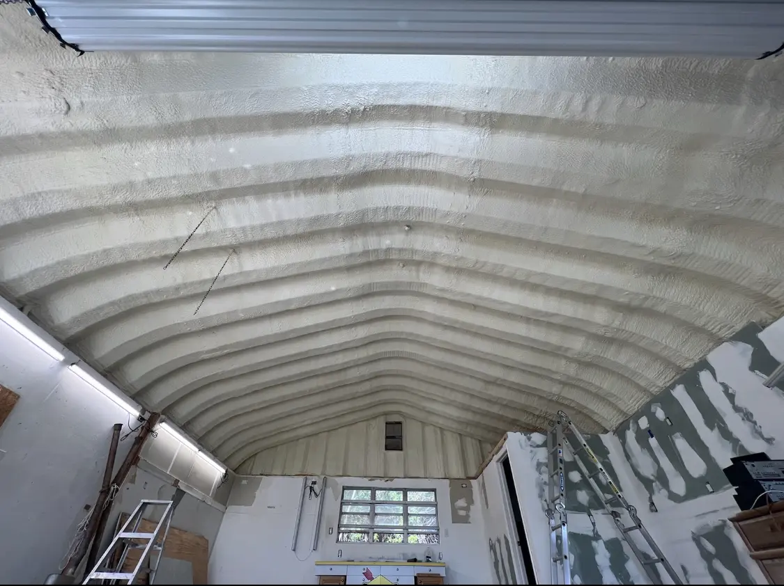 Spray polyurethane foam applied to the underside of a metal roof deck in Buffalo